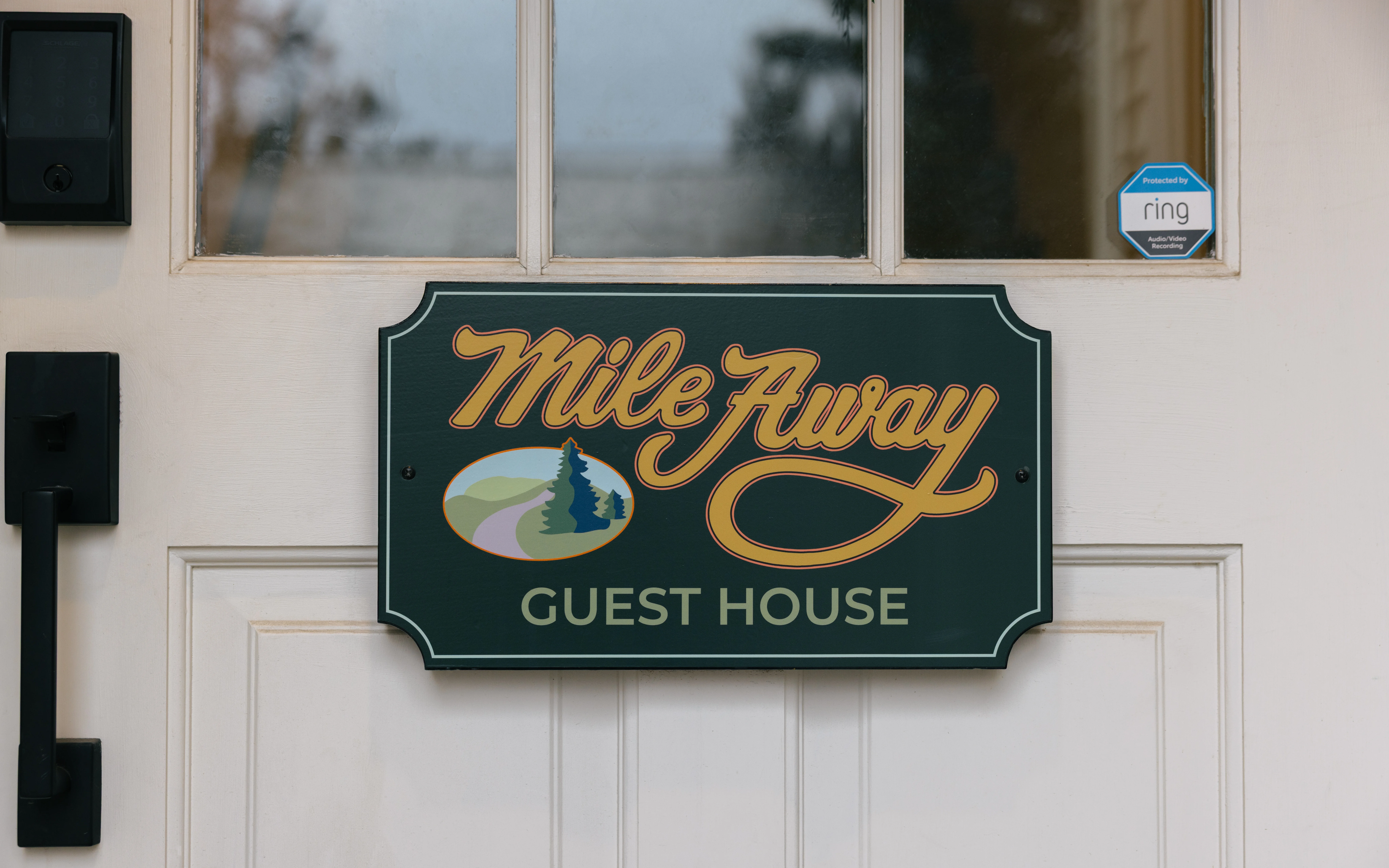 Guest house entry landing with welcoming decor and access to the upper apartment